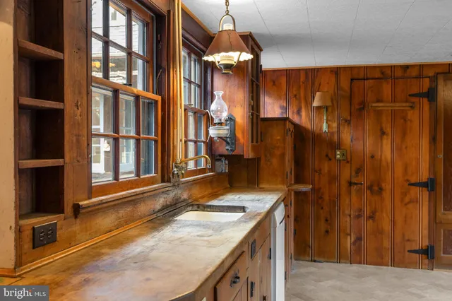 a white toilet sitting next to a bathroom sink