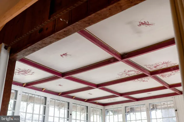 a view of a porch with a wooden fence