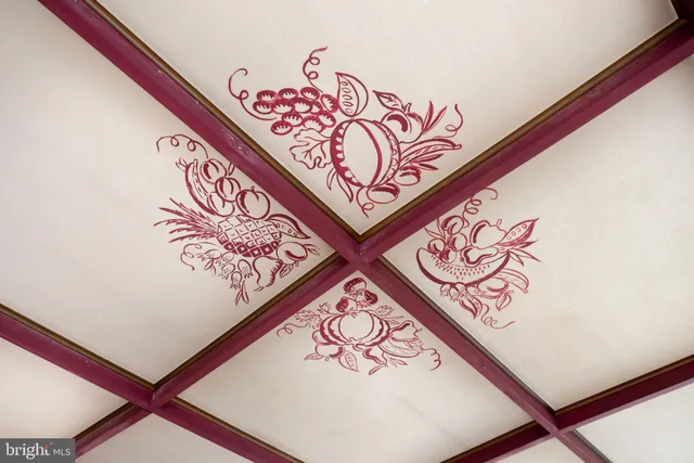 a view of a porch with furniture and floor to ceiling window