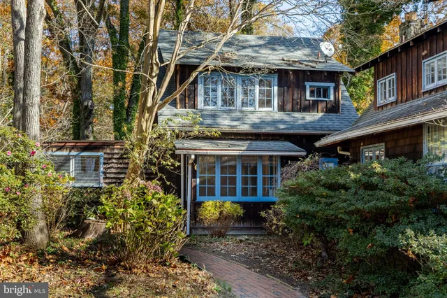 a kitchen with stainless steel appliances kitchen island granite countertop a stove and a refrigerator