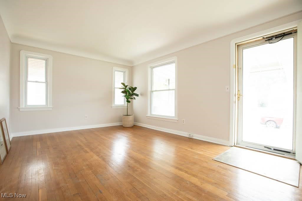 12822 Grannis Road Cleveland, OH 44125 - Photo 3 of 44 Empty room with light hardwood / wood-style flooring