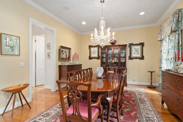 a dining room with furniture and window