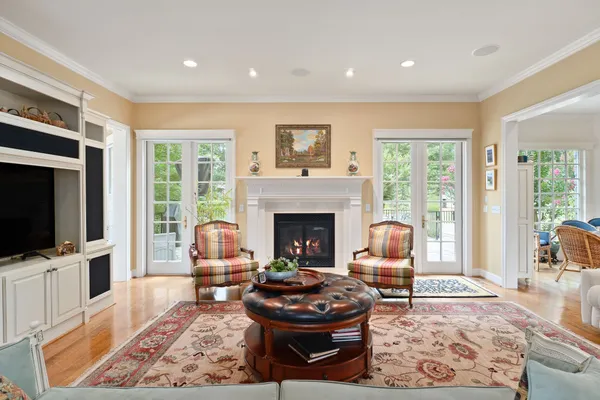 a kitchen with granite countertop white cabinets and a window