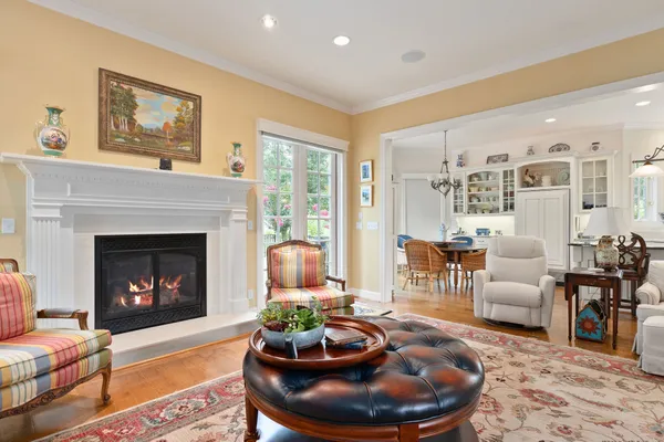 a living room with furniture and floor to ceiling windows