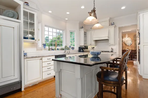 a bedroom with furniture and wooden floor
