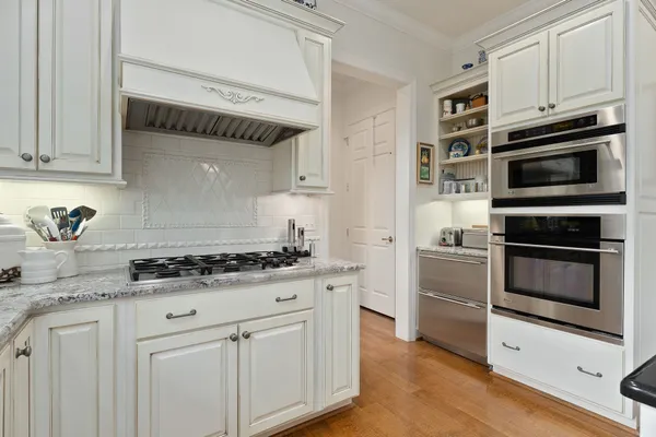 a living room with furniture a rug and a large window