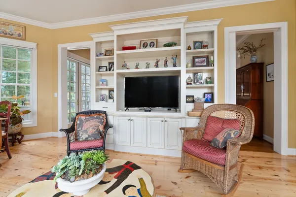 a bathroom with a sink a vanity a mirror and a bathtub
