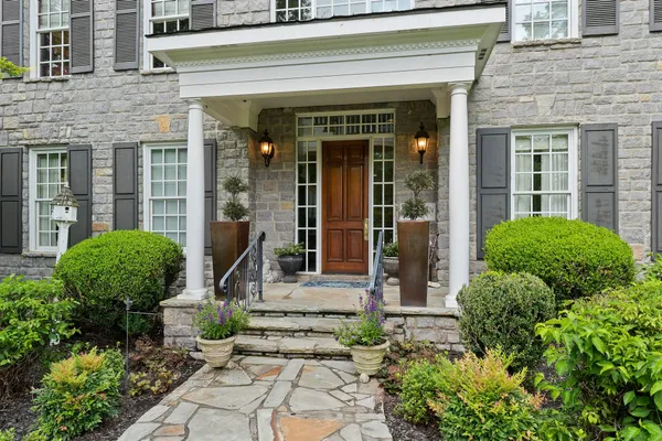 a front view of a house with a garage