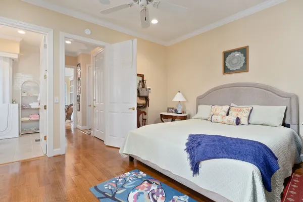 a living room with large window and furniture