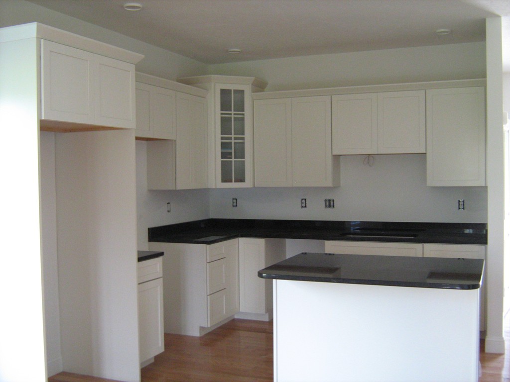 302 Piper Road, Unit 2A West Springfield, MA 01089 - Photo 3 of 6 a kitchen with granite countertop white cabinets and a sink