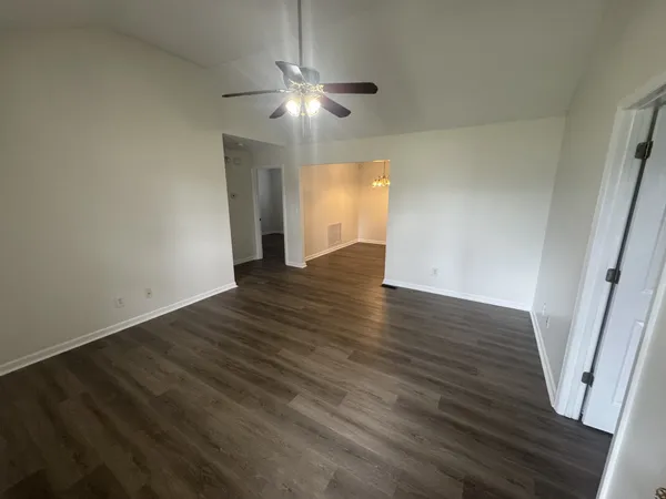 a view of a kitchen cabinets and wooden floor