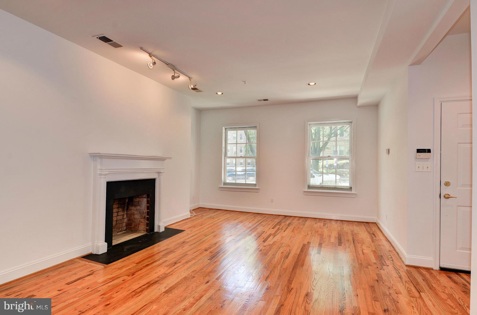 2801 Connecticut Avenue Northwest, Unit 4 Washington, DC 20008 - Photo 3 of 19 Living Room with wood-burning fireplace