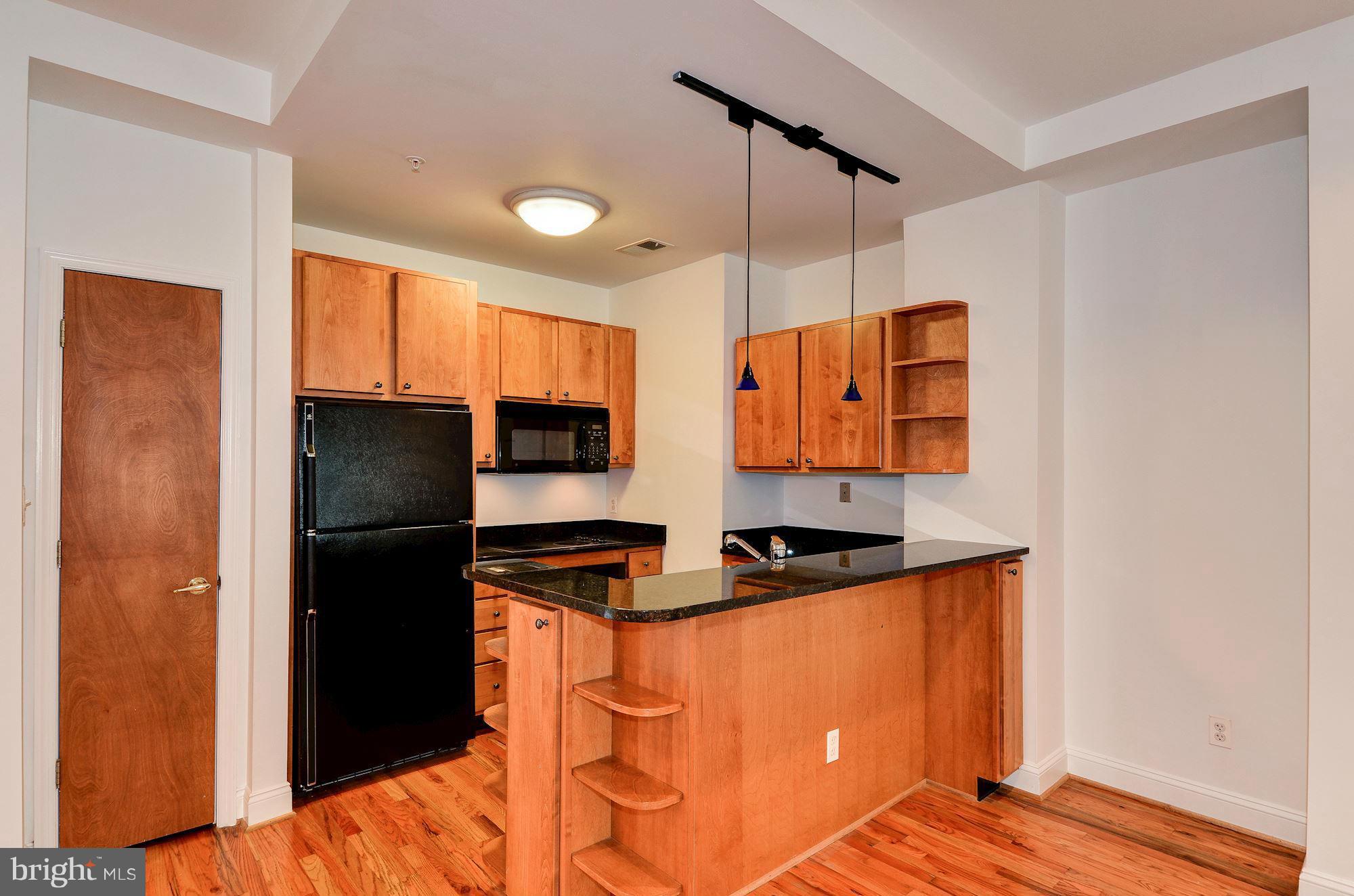 2801 Connecticut Avenue Northwest, Unit 4 Washington, DC 20008 - Photo 6 of 19 Kitchen with custom maple cabinets