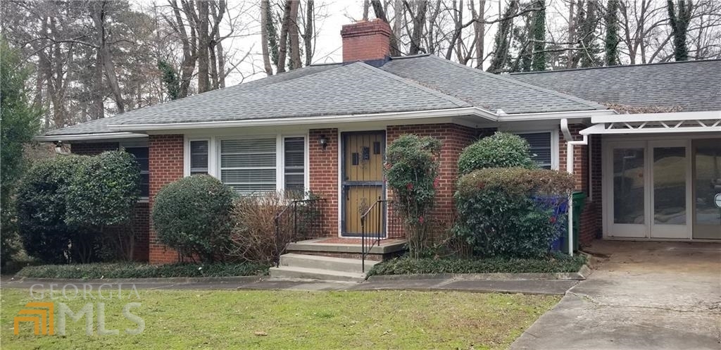 1307 Harvard Road Northeast, Unit D220 Atlanta, GA 30306 - Photo 1 of 1 a view of a house with garden and plants