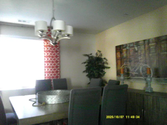 a dining room with a table and chairs