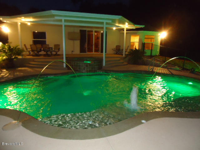 129 East Crisafulli Road Merritt Island, FL 32953 - Photo 27 of 41 27 Night Pool