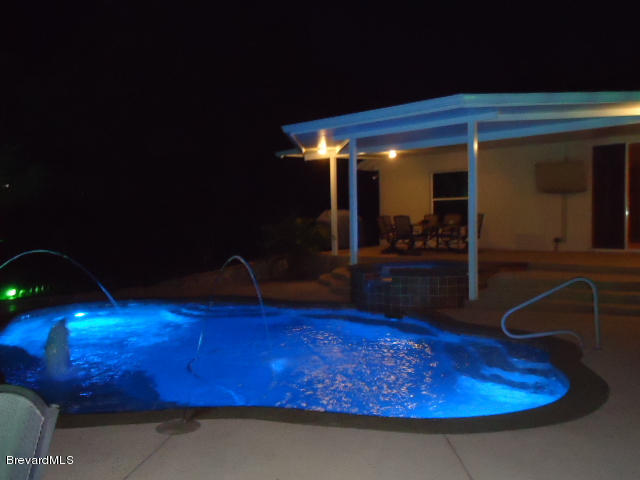 129 East Crisafulli Road Merritt Island, FL 32953 - Photo 28 of 41 28 Night Pool