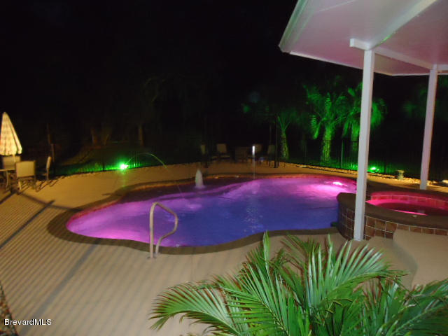 129 East Crisafulli Road Merritt Island, FL 32953 - Photo 29 of 41 29 Night Pool