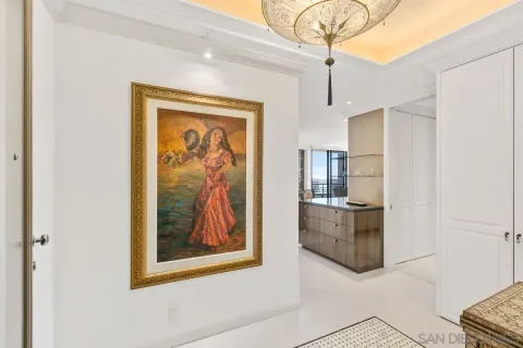 a view of a hallway with closet and cabinet