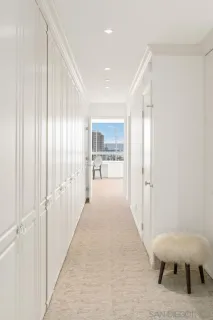 a very nice looking room with a large window and couch