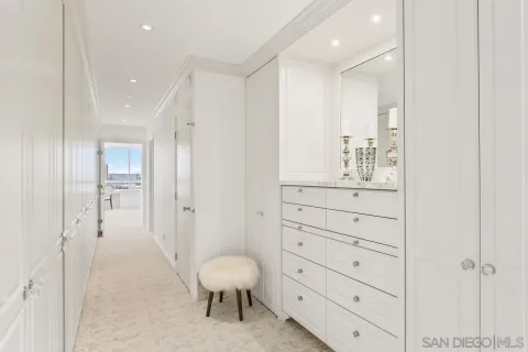 a bedroom with a large window and a bed