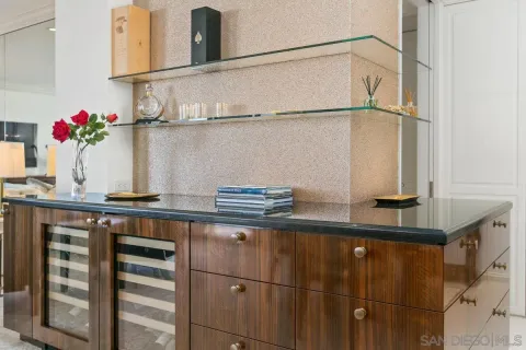 a kitchen with a refrigerator and cabinets