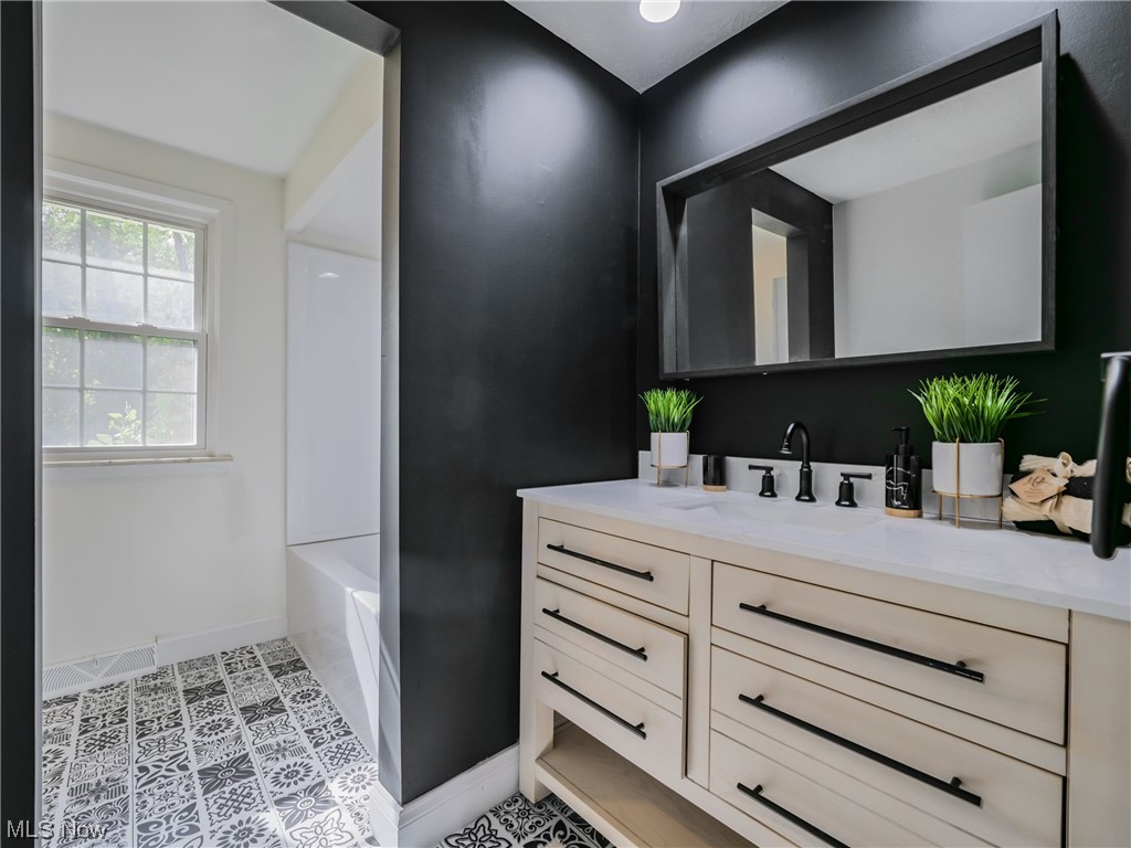 4746 Farnhurst Road Cleveland, OH 44124 - Photo 15 of 29 Bathroom with tile flooring, vanity, and bathtub / shower combination