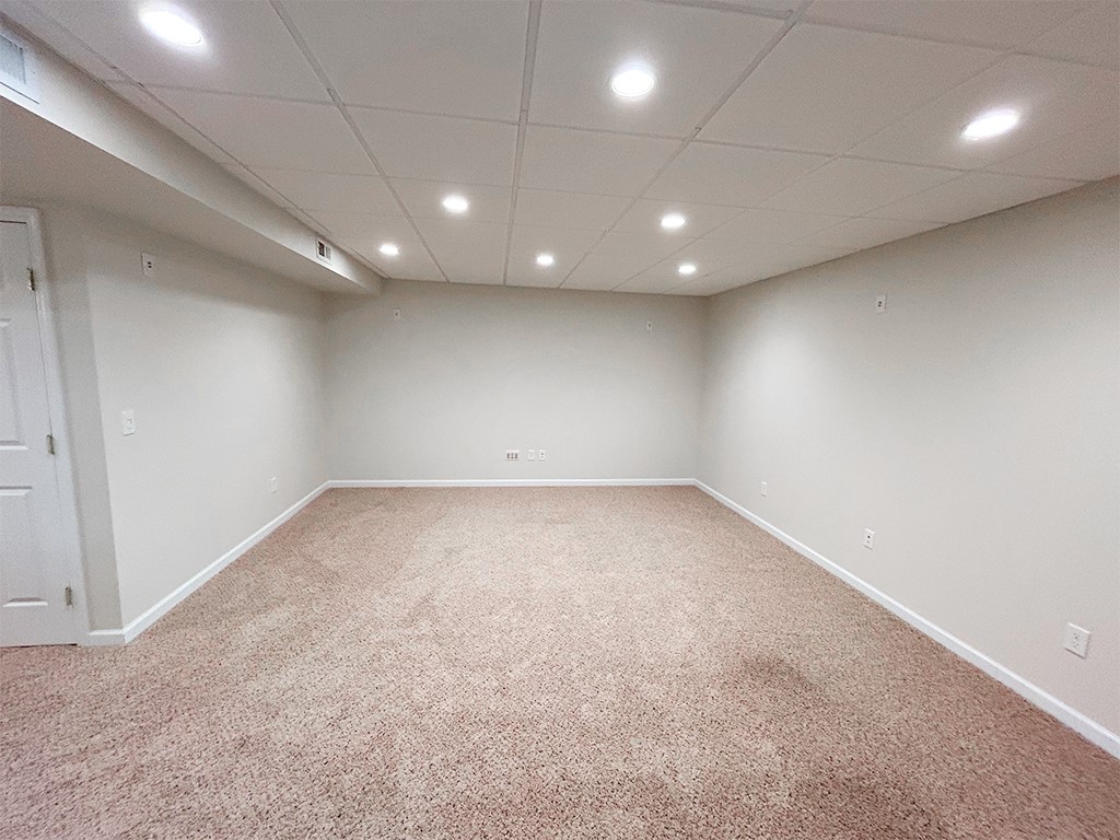 1978 Spring Ridge Drive Xenia, OH 45385 - Photo 31 of 44 This spacious, finished basement features recessed lighting and plush carpeting, perfect for entertainment or relaxation.