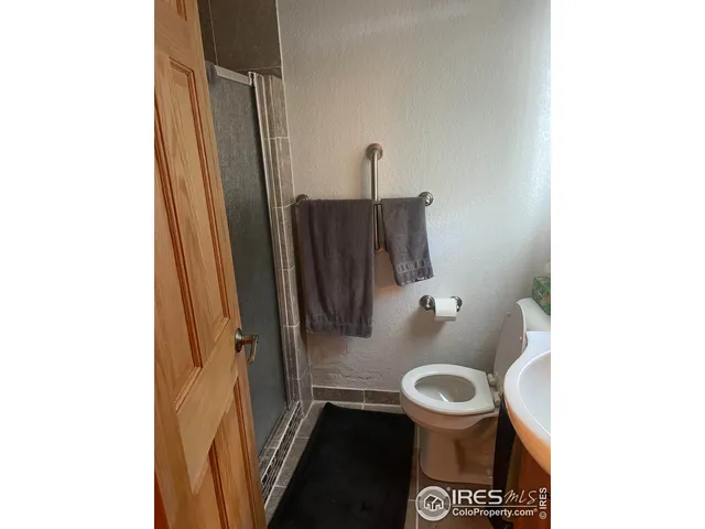 a bath room with a toilet and a sink