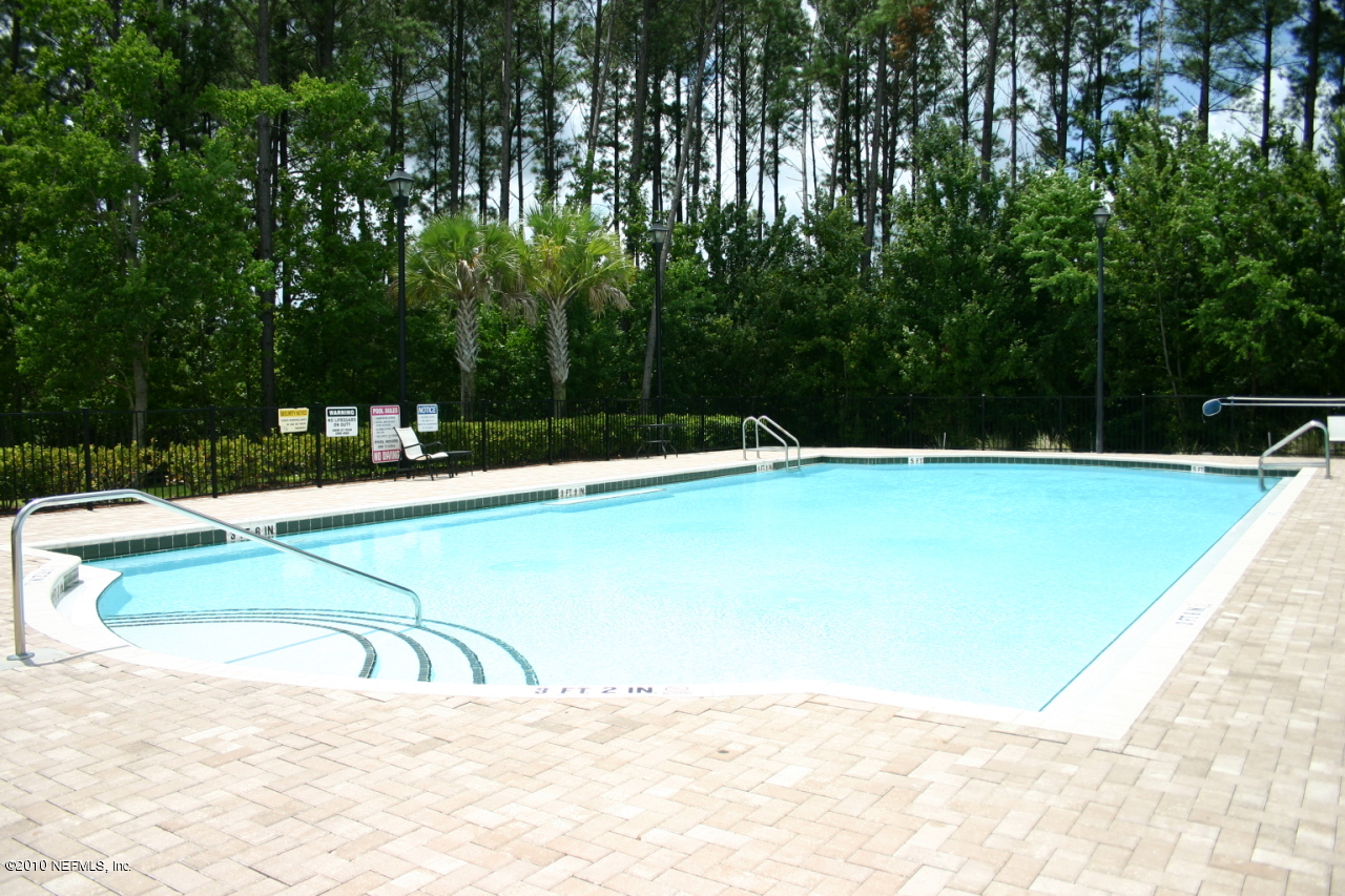 7920 Merrill Road, Unit 1002 Jacksonville, FL 32277 - Photo 16 of 18 a view of swimming pool with a backyard
