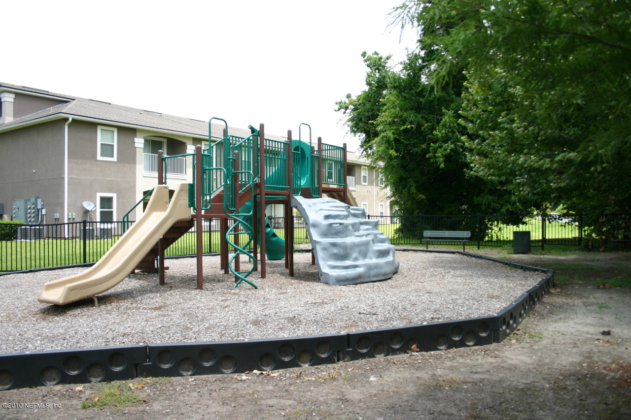 7920 Merrill Road, Unit 1002 Jacksonville, FL 32277 - Photo 18 of 18 a view of a park with swings