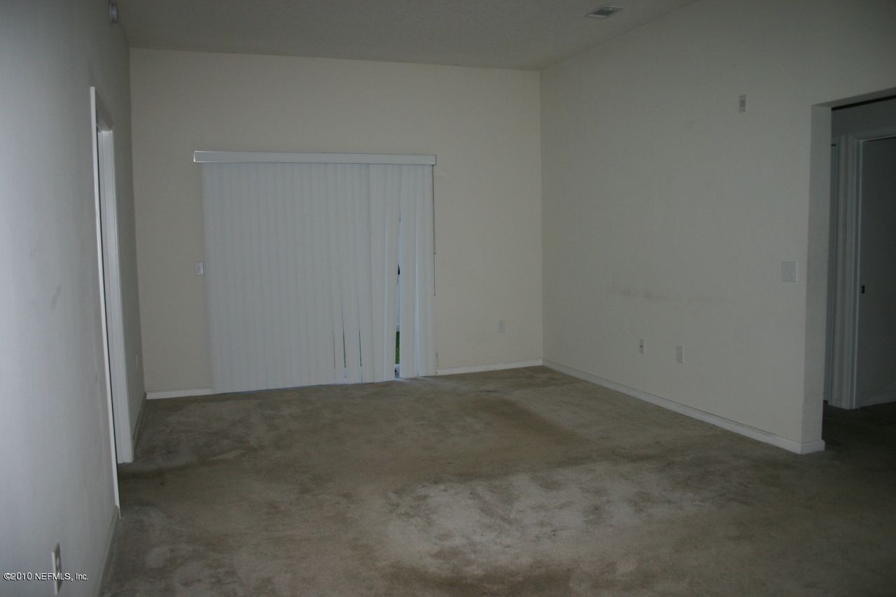 7920 Merrill Road, Unit 1002 Jacksonville, FL 32277 - Photo 6 of 18 a view of an empty room