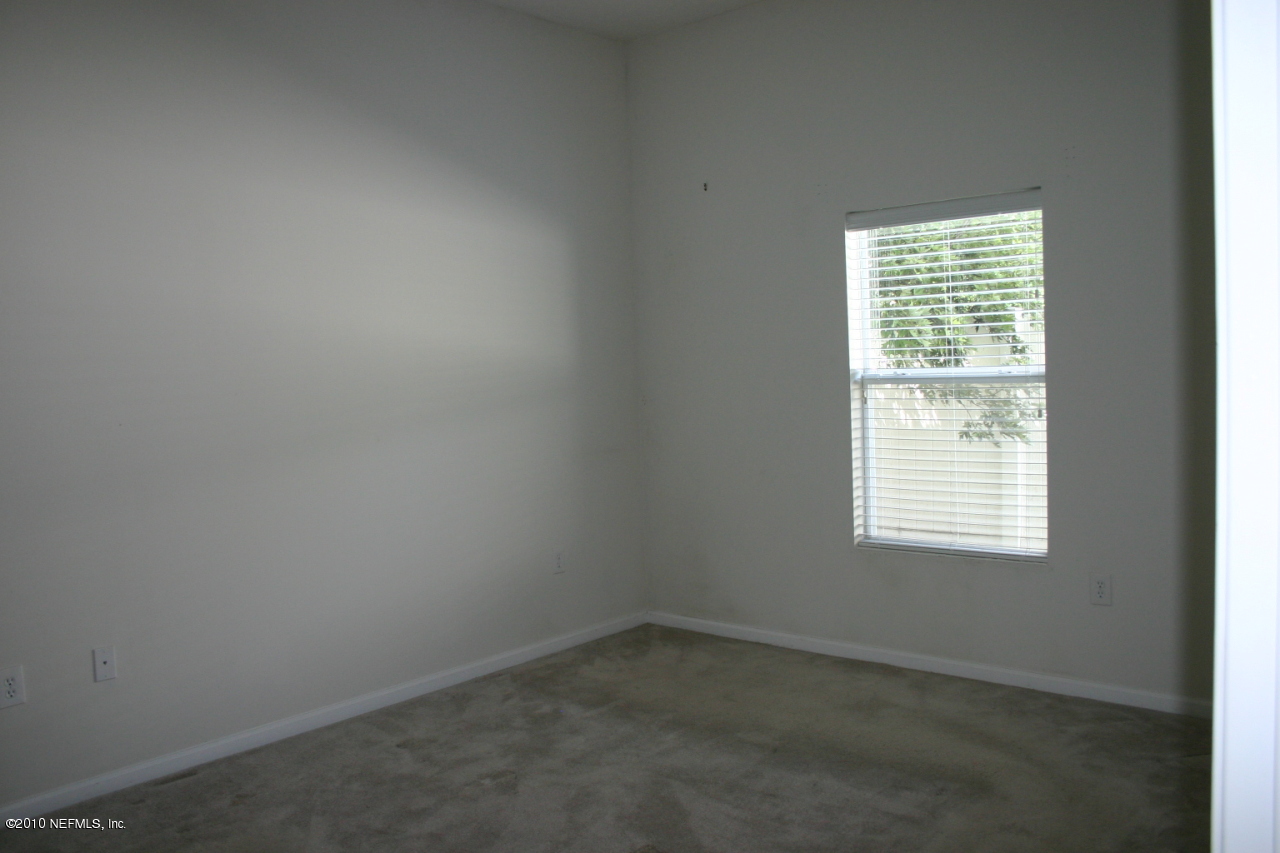 7920 Merrill Road, Unit 1002 Jacksonville, FL 32277 - Photo 8 of 18 an empty room with a window