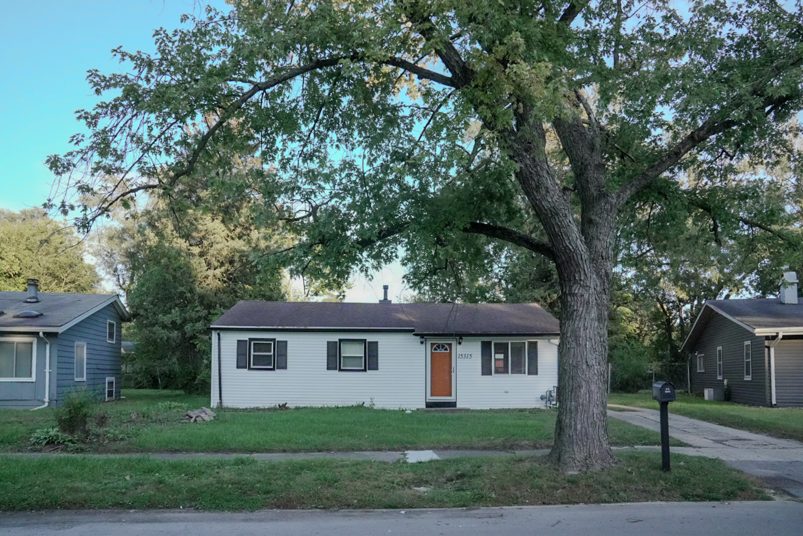 15315 Cherry Lane Markham, IL 60428 - Photo 31 of 34 a front view of a house with a garden