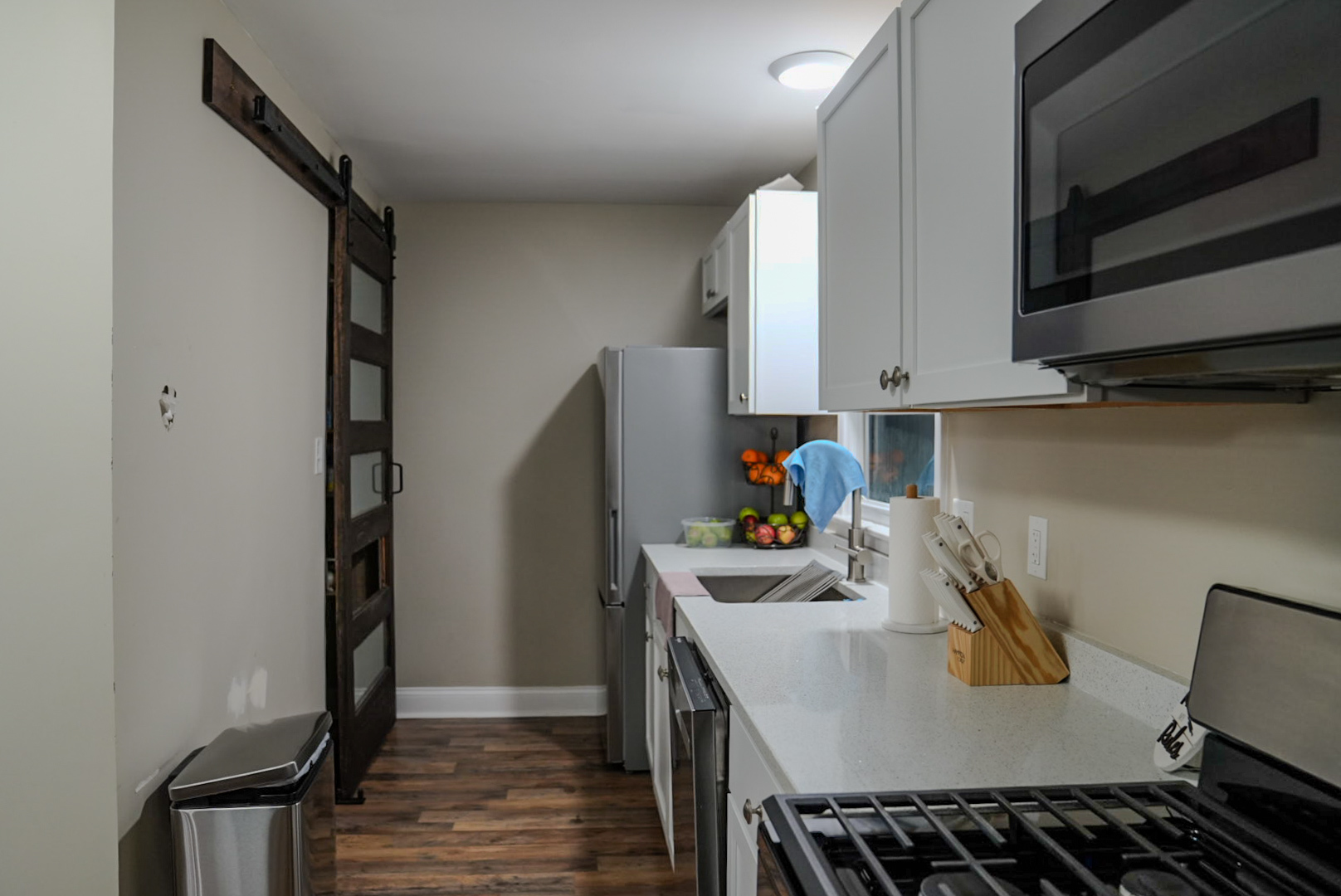 15315 Cherry Lane Markham, IL 60428 - Photo 5 of 34 a kitchen with stainless steel appliances a stove a refrigerator and cabinets