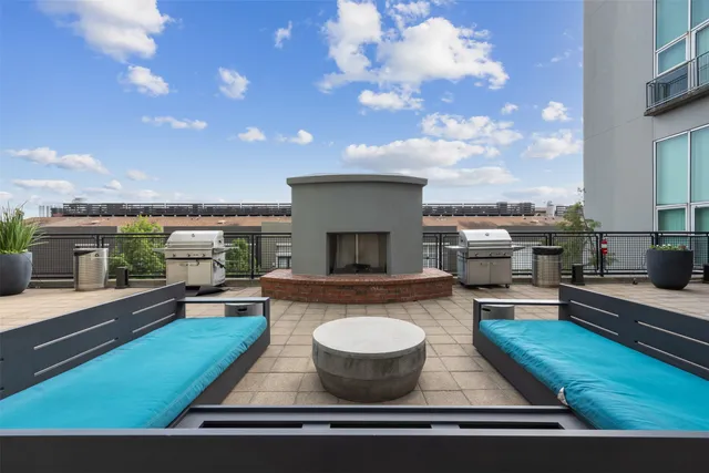 a view of swimming pool with seating space