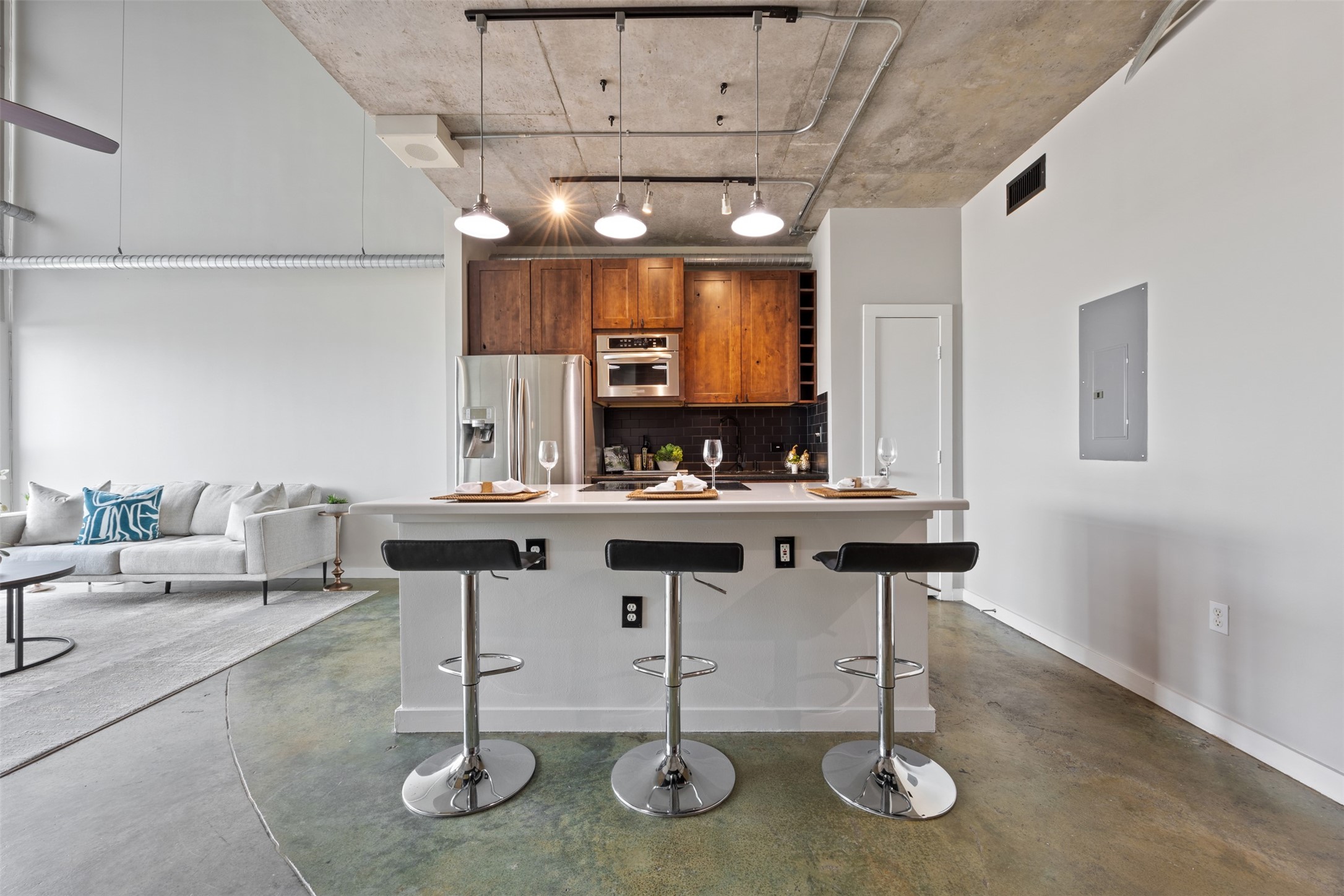 2000 Bagby Street, Unit 7414 Houston, TX 77002 - Photo 8 of 26 a kitchen with table chairs cabinets and stainless steel appliances