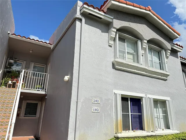 a view of a balcony with chairs