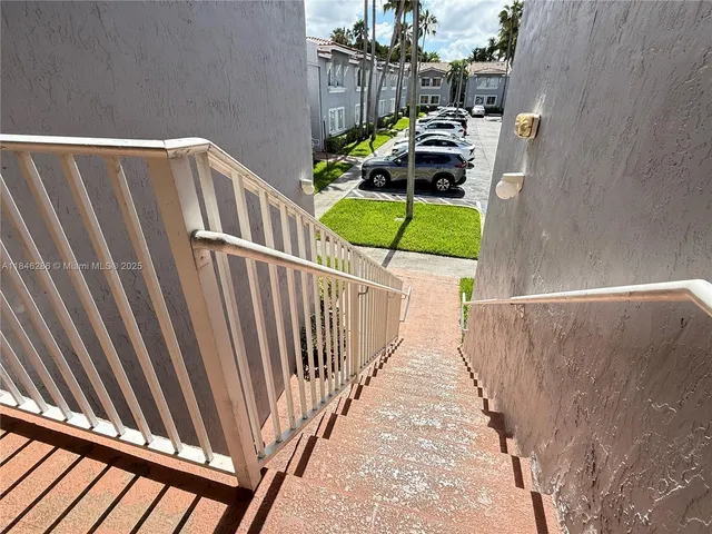 a kitchen with appliances cabinets and a sink