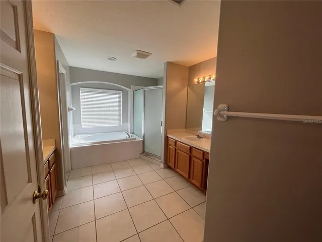 a bathroom with a bathtub and a sink