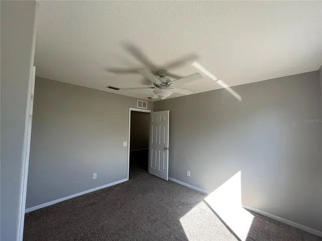 a bathroom with a sink a toilet a tub and shower