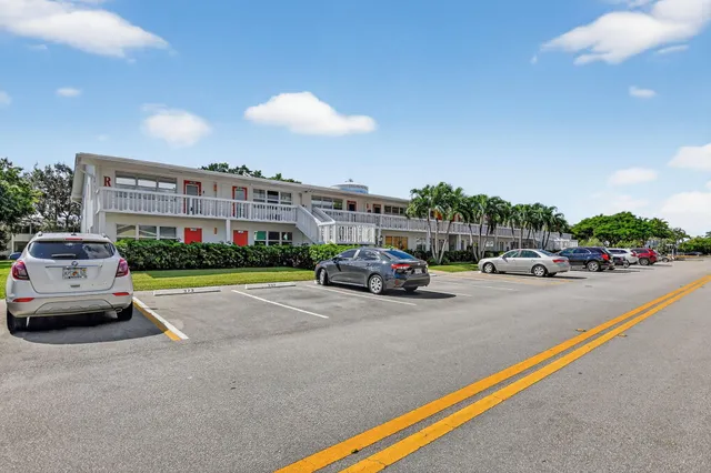 a view of street with parked cars