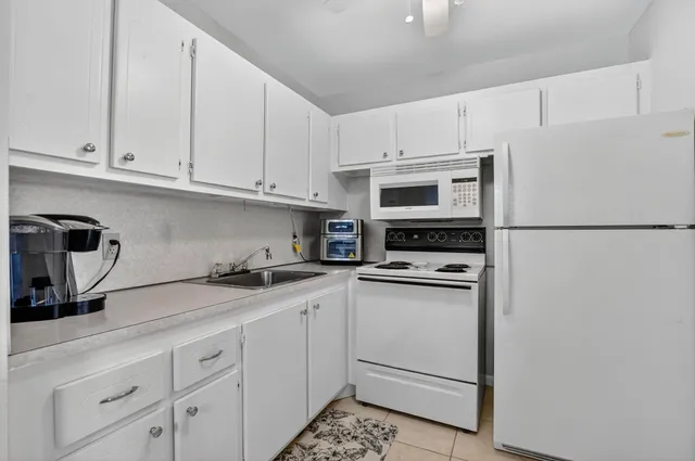 a bathroom with a sink toilet and mirror