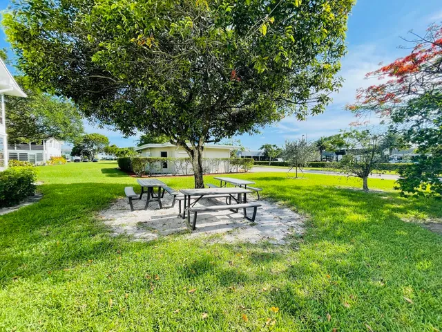 a couple of table and chairs in front of building