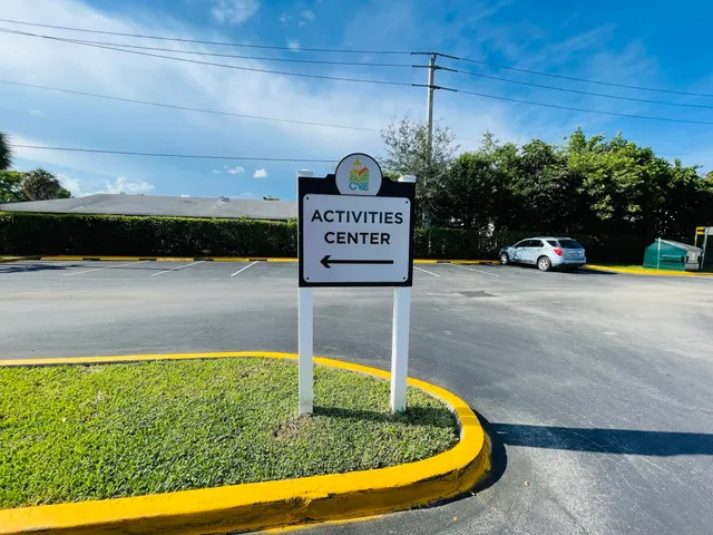a view of a patio with table and chairs with wooden floor and fence