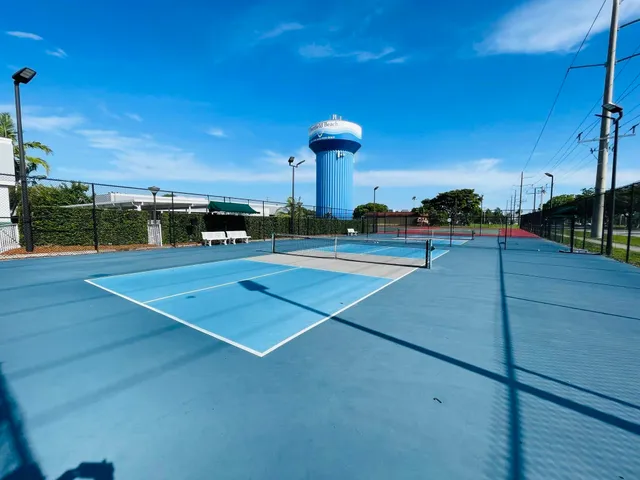 a car parked in the grass near a building