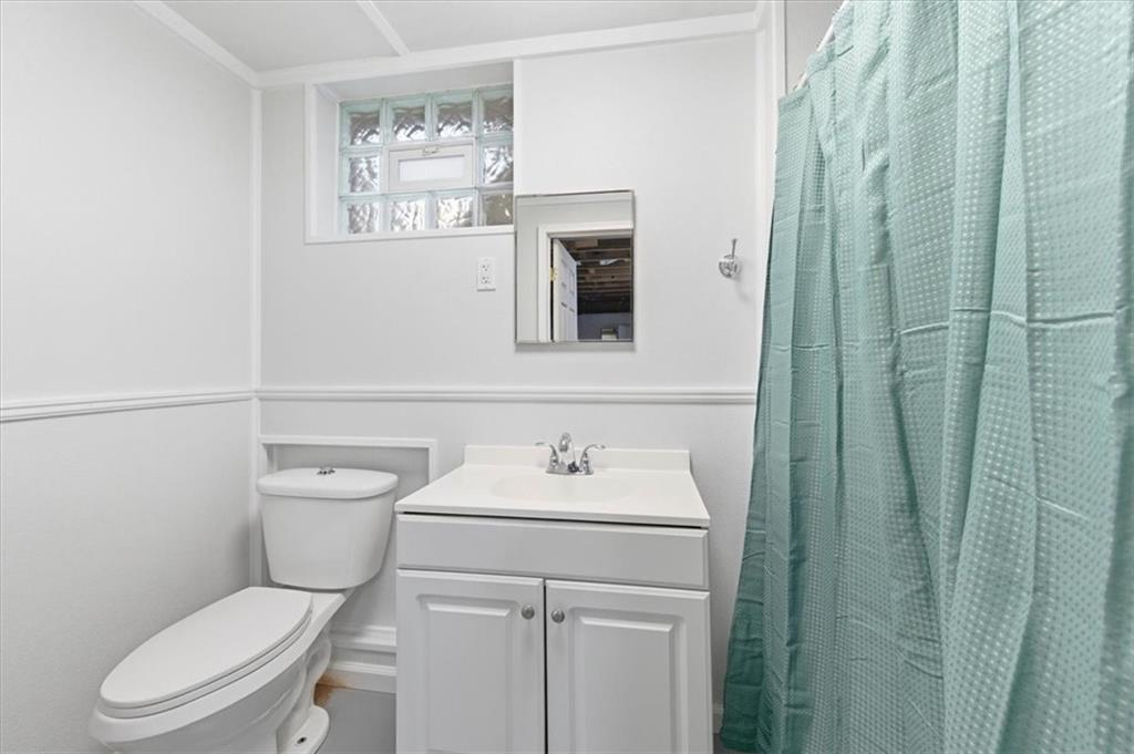 344 Winfield Road Cabot, PA 16023 - Photo 22 of 30 a bathroom with a toilet sink and mirror