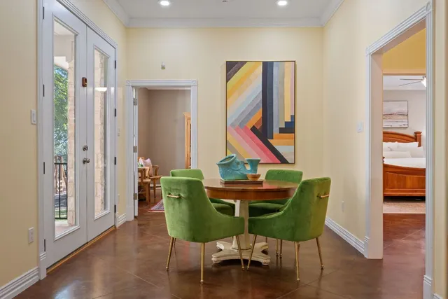 a view of a room with furniture and wooden floor