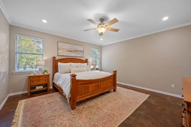 a bedroom with a bed and window