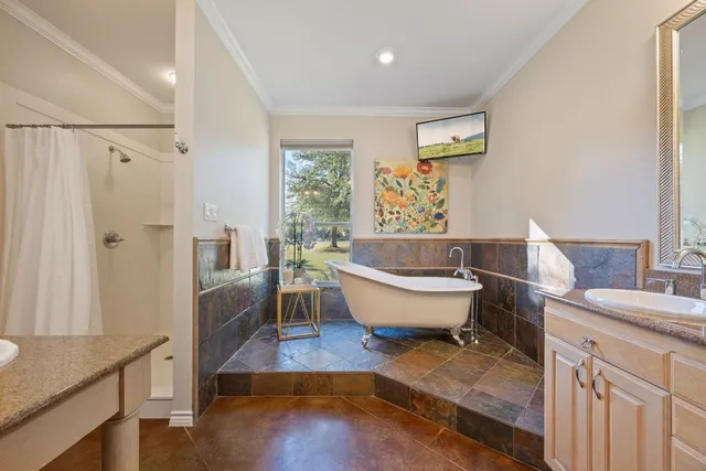 a bathroom with a bathtub sink and toilet